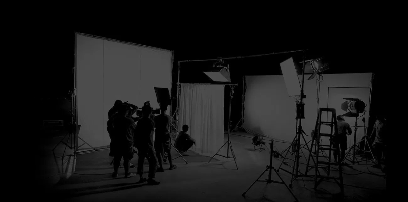 A film Set with Crew Members and Studio Lighting Equipment